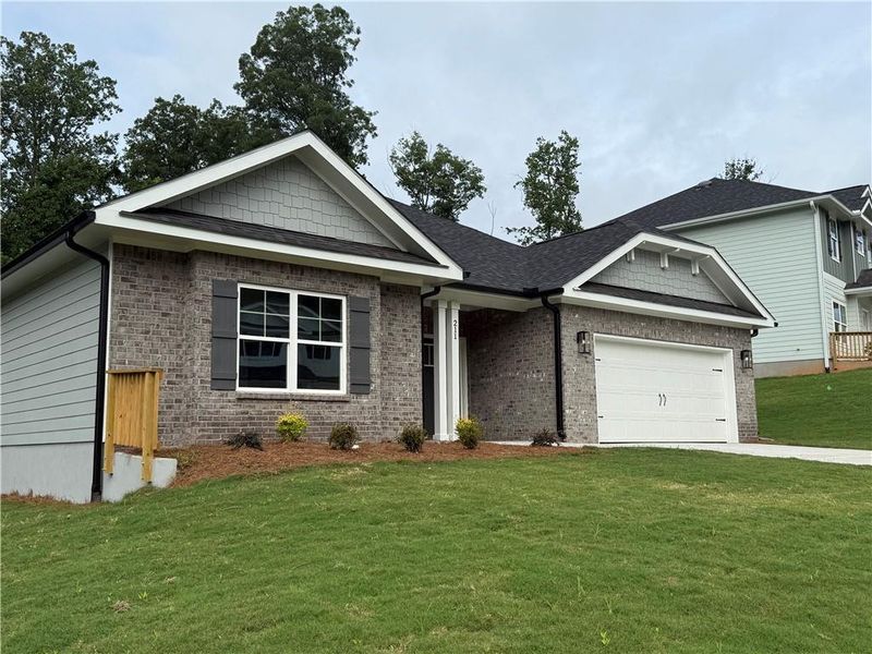 Front exterior of a new home in Thunder Ridge, Dawsonville, GA, highlighting curb appeal (Image 24).