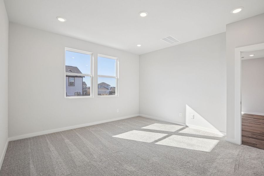 A room with a window and a rug. A room with a window and a rug.