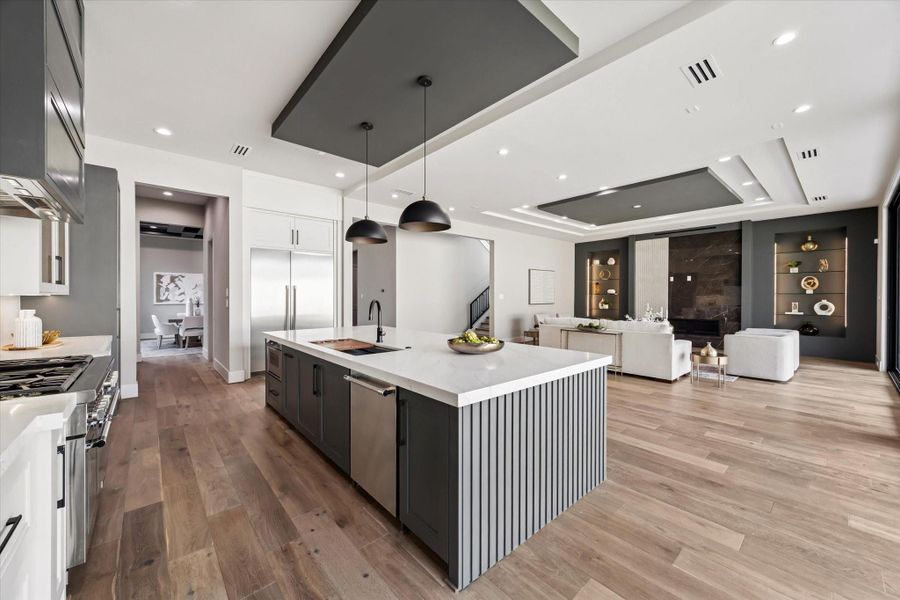 Thermador appliances elevate the space with a professional gas range featuring double ovens, a sleek vent hood, and a convenient pot filler. The kitchen is further equipped with a dishwasher and microwave, blending performance and luxury for the ultimate cooking experience.