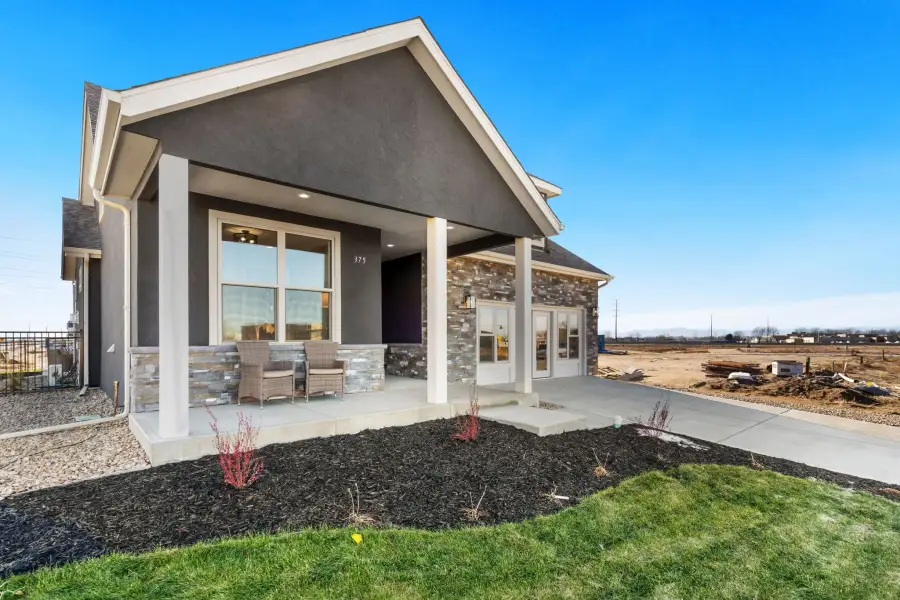 Exterior details and patio area of a home in The Courtyards at Lupton Village, Fort Lupton (Image 22).