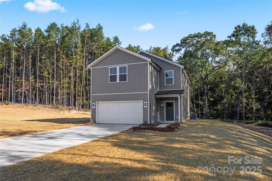 Front exterior of a new home in , Albemarle, NC, highlighting curb appeal (Image 2).