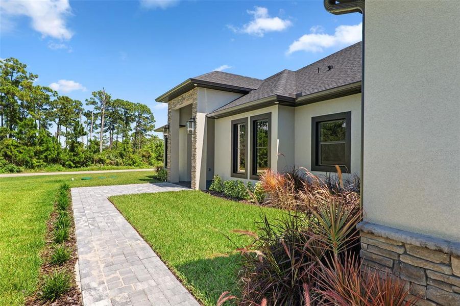Front exterior of a new home in , Malabar, FL, highlighting curb appeal (Image 24).