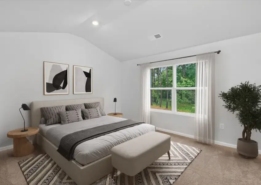 The master bedroom has tall ceilings