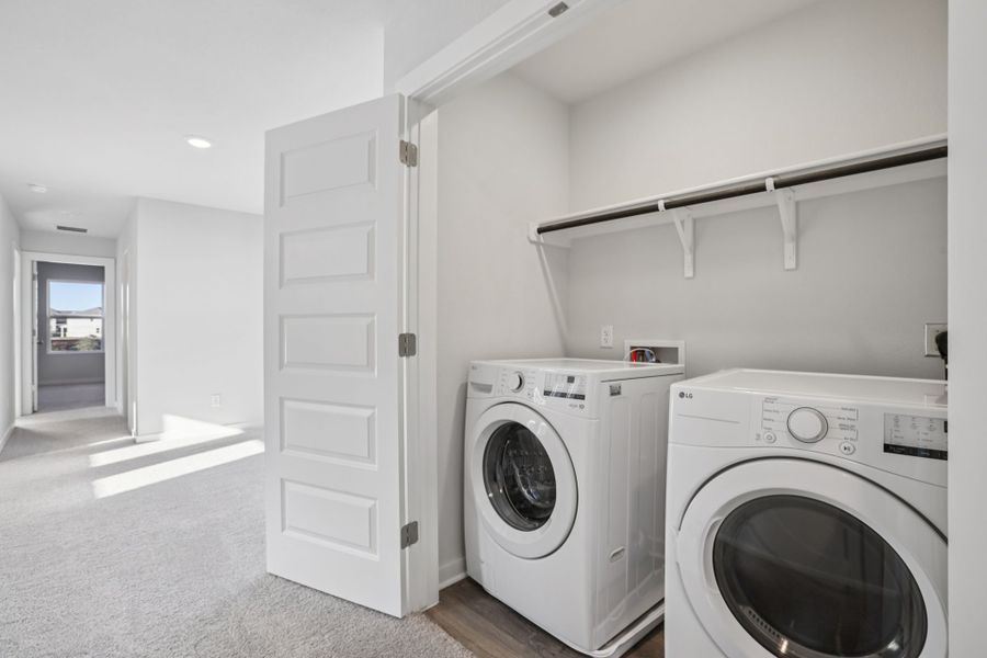 A room with a washer and dryer.