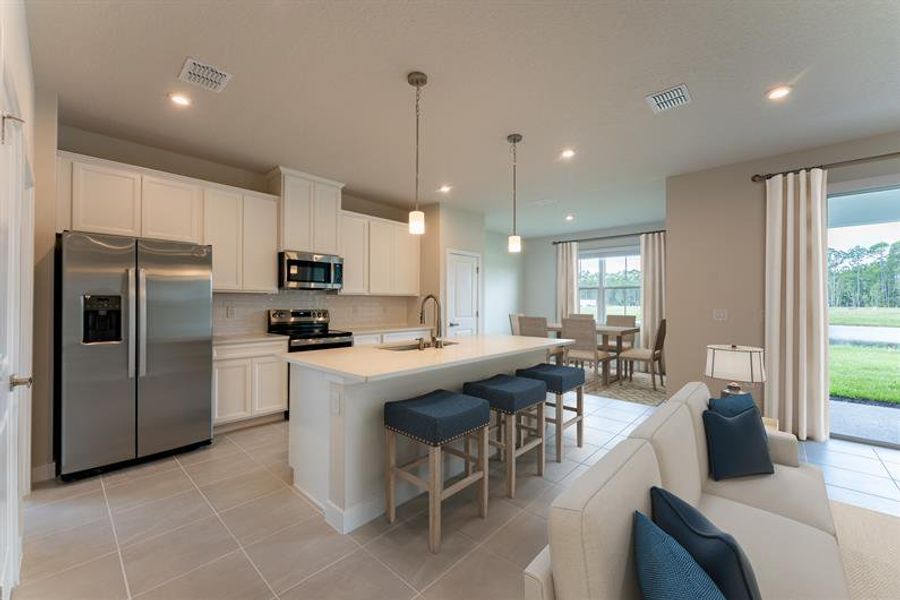 Representative furnished interior of a home built from the Harrison by Ryan Homes in The Palms at Venetian Bay, New Smyrna Beach (Image 4).