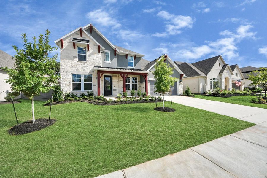Front exterior of a new home in ARTAVIA: Hilltop Collection, Conroe, TX, highlighting curb appeal (Image 22). Front exterior of a new home in ARTAVIA: Hilltop Collection, Conroe, TX, highlighting curb appeal (Image 22).