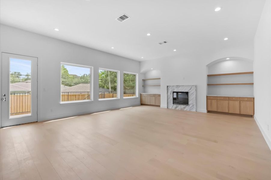 Oversized windows overlooking the backyard. Oversized windows overlooking the backyard.