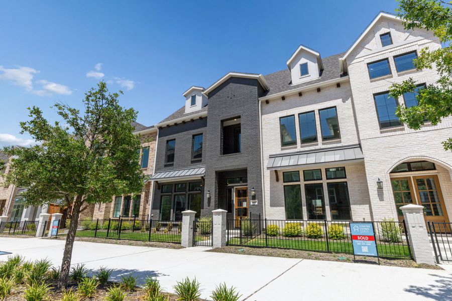 Front exterior of a new home in Newman Village Townhomes, Frisco, TX, highlighting curb appeal (Image 26).