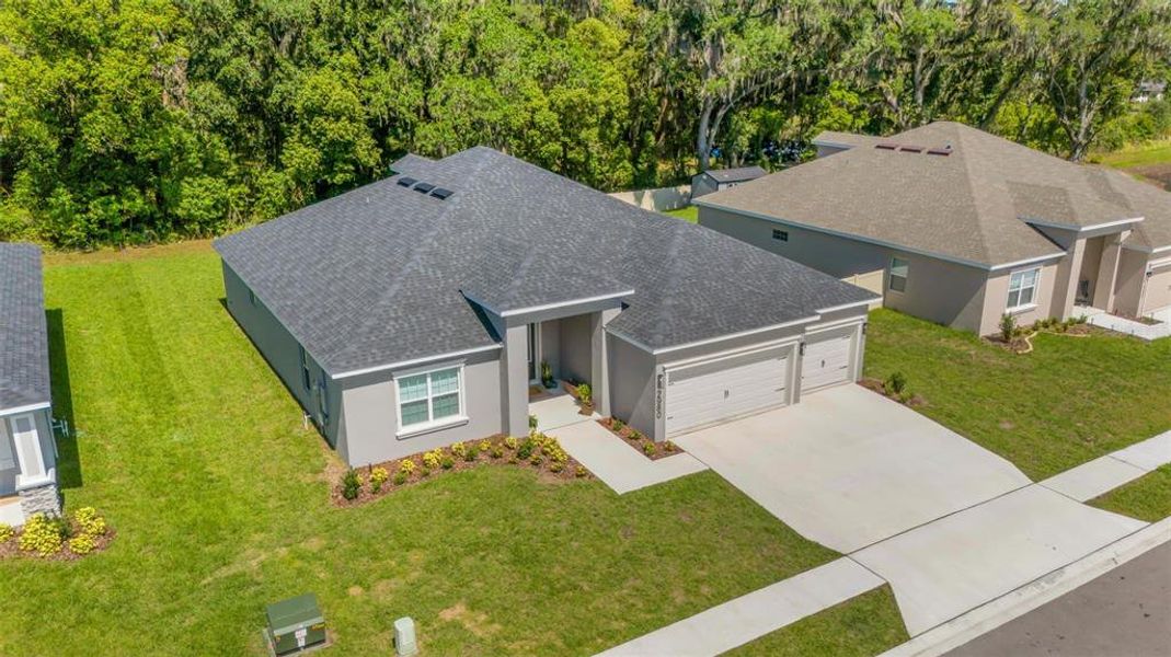Front exterior of a new home in , Lakeland, FL, highlighting curb appeal (Image 2). Front exterior of a new home in , Lakeland, FL, highlighting curb appeal (Image 2).