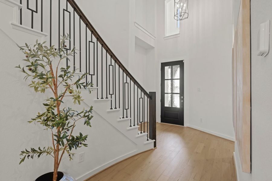 Another look at the open and grand entryway—an impressive welcome to the home. Head upstairs to discover a spacious flex room and two generously sized secondary bedrooms, perfect for family or guests.