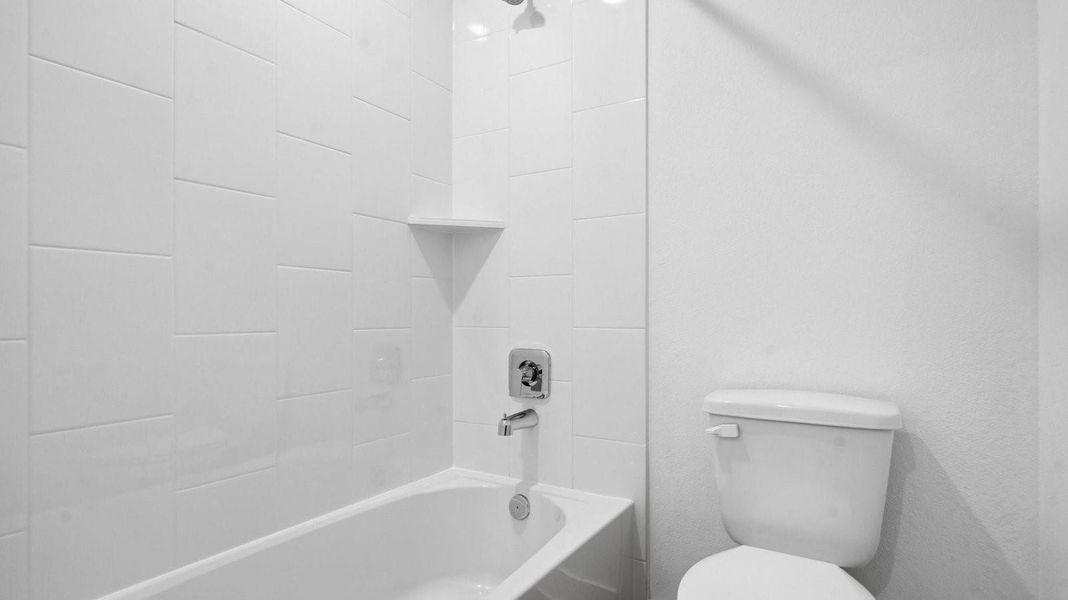 A well-designed bathroom equipped with granite countertops, a standing tub, and a single vanity. A well-designed bathroom equipped with granite countertops, a standing tub, and a single vanity.