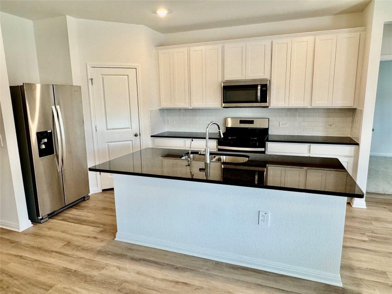 Furnished interior view inside a new home in Lexington Parke, Del Valle (Image 4).