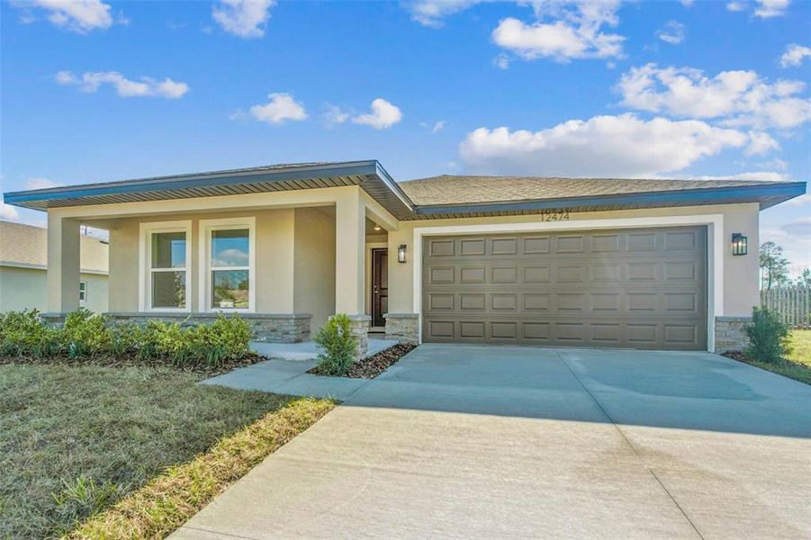 Front exterior of a new home in , Spring Hill, FL, highlighting curb appeal (Image 34).