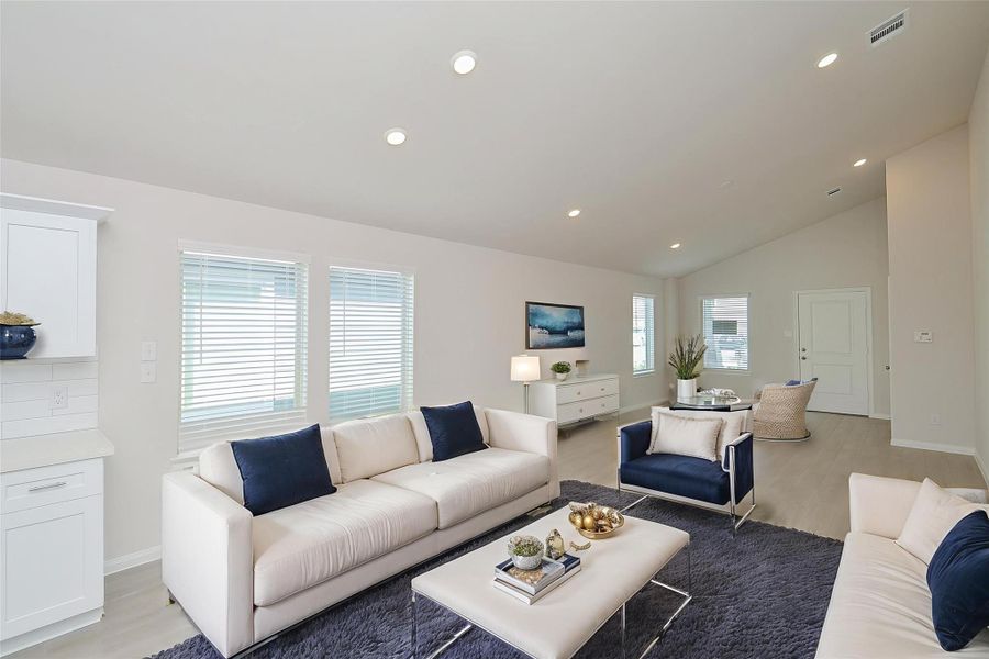 The soaring vaulted ceilings and recessed lighting create an airy and expansive atmosphere. The soaring vaulted ceilings and recessed lighting create an airy and expansive atmosphere.