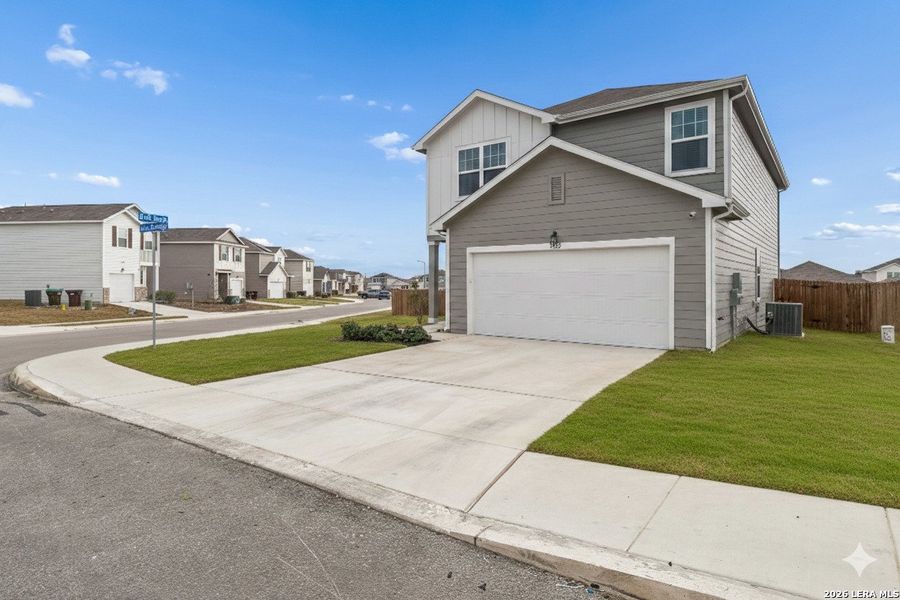 Front exterior of a new home in Liberte, Converse, TX, highlighting curb appeal (Image 1). Front exterior of a new home in Liberte, Converse, TX, highlighting curb appeal (Image 1).