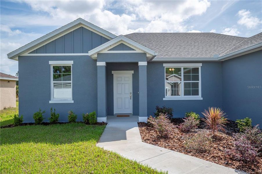 Front exterior of a new home in , Mulberry, FL, highlighting curb appeal (Image 21).