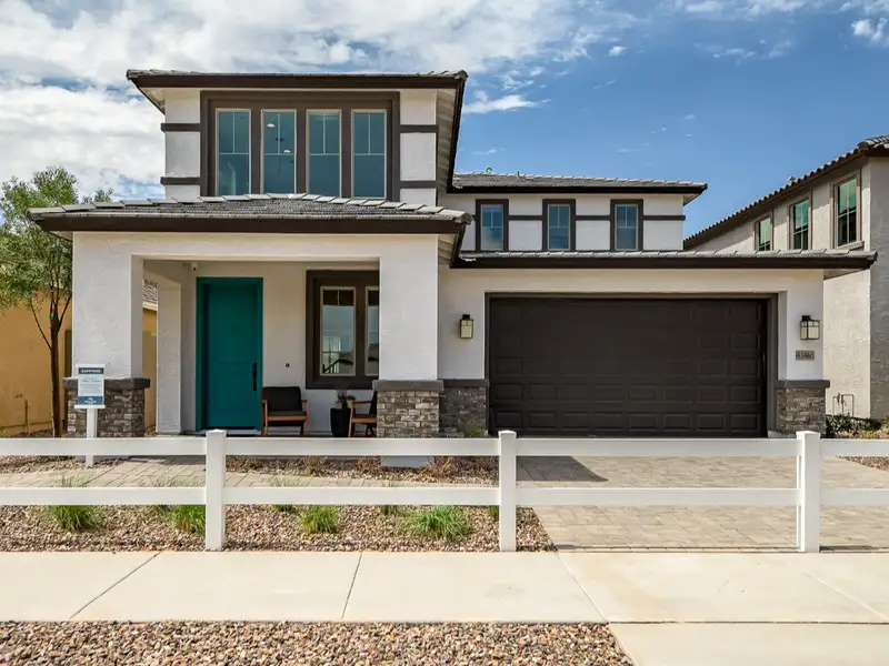 Front exterior of a new home in Mesquite at North Creek, Queen Creek, AZ, highlighting curb appeal (Image 1). Front exterior of a new home in Mesquite at North Creek, Queen Creek, AZ, highlighting curb appeal (Image 1).