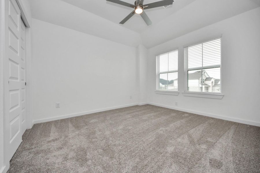 Secondary bedroom features plush carpeting, large windows that let in plenty of natural light, bright paint, and spacious closets. Secondary bedroom features plush carpeting, large windows that let in plenty of natural light, bright paint, and spacious closets.