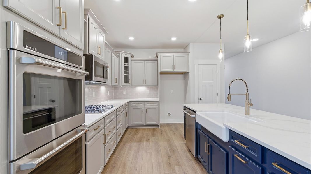 First-rate kitchen with functional layout, designer pendant lighting, and a large center island in Piedmont, SC First-rate kitchen with functional layout, designer pendant lighting, and a large center island in Piedmont, SC