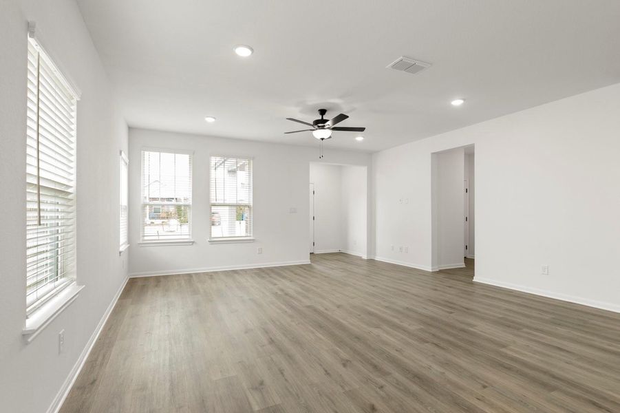Unfurnished living room featuring recessed lighting, wood finished floors, and ceiling fan