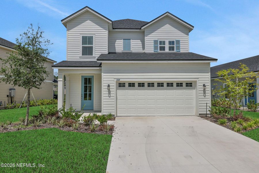 Front exterior of a new home in TrailMark, St. Augustine, FL, highlighting curb appeal (Image 1). Front exterior of a new home in TrailMark, St. Augustine, FL, highlighting curb appeal (Image 1).