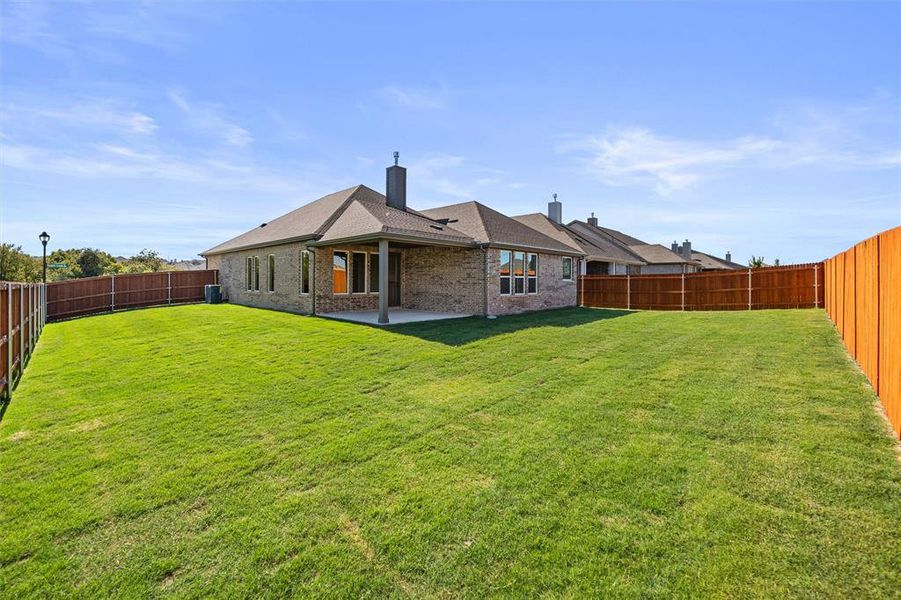 Exterior details and patio area of a home in Morningstar, Aledo (Image 2). Exterior details and patio area of a home in Morningstar, Aledo (Image 2).