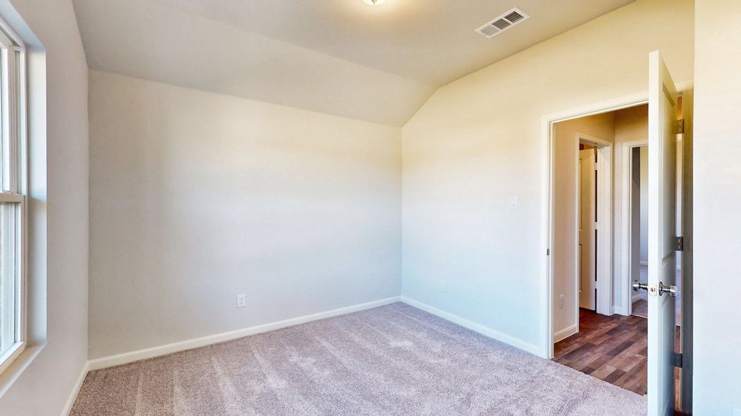 A hallway with white walls. A hallway with white walls.