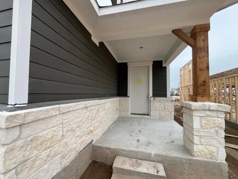 Exterior details and patio area of a home in Lariat, Liberty Hill (Image 3).