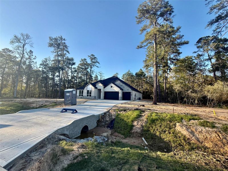 Front exterior of a new home in Butlers Bend Estates, Pinehurst, TX, highlighting curb appeal (Image 23).
