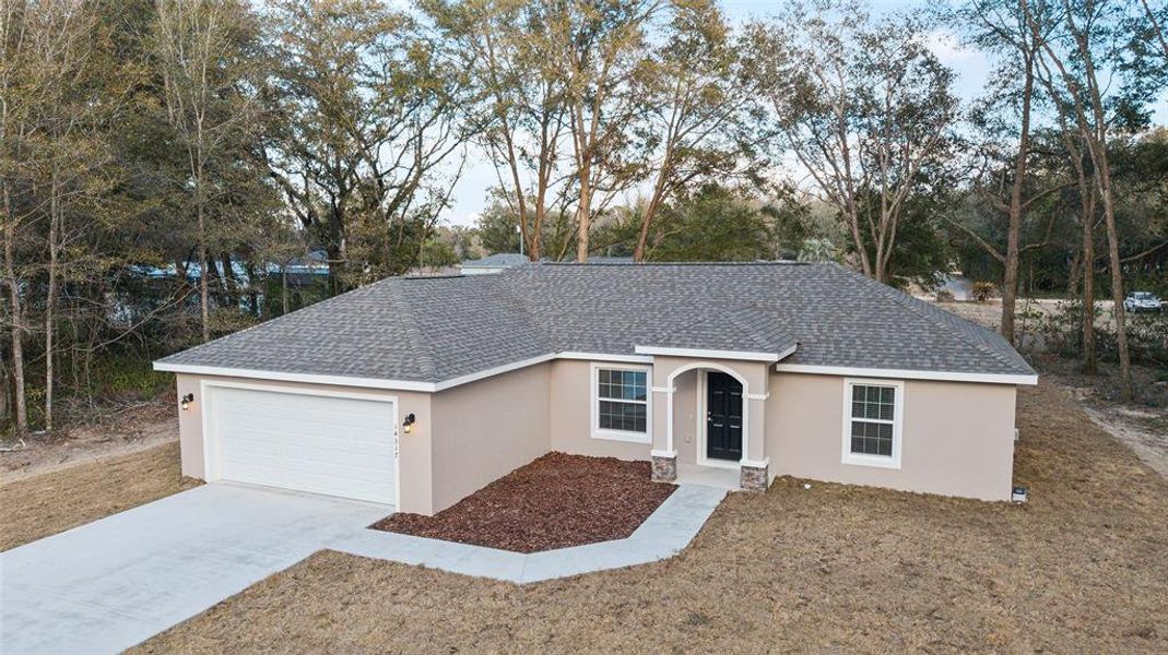 Front exterior of a new home in , Summerfield, FL, highlighting curb appeal (Image 25).