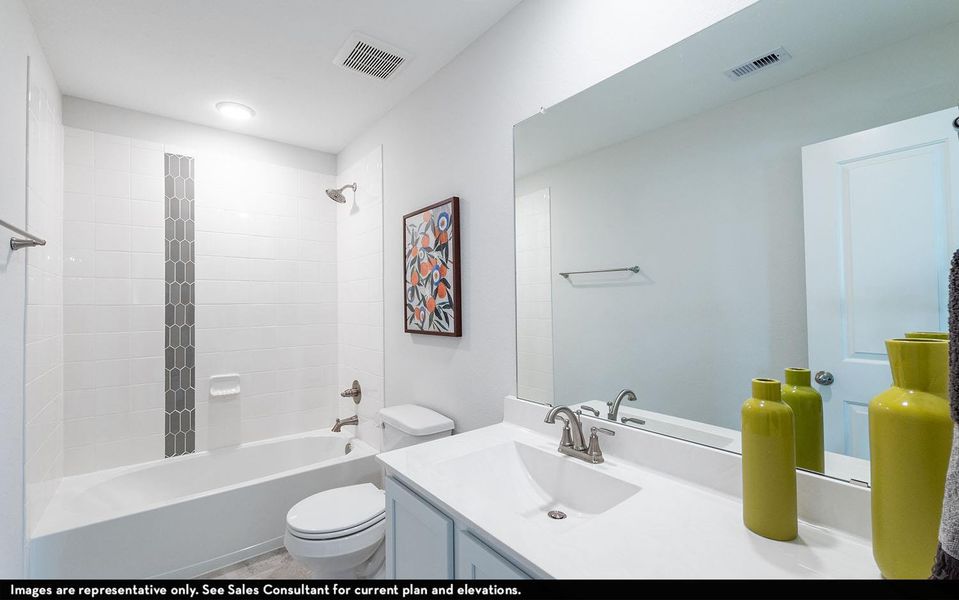 Bathroom featuring vanity and shower / bathtub combination