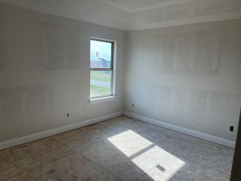 Unfurnished room with baseboards Unfurnished room with baseboards