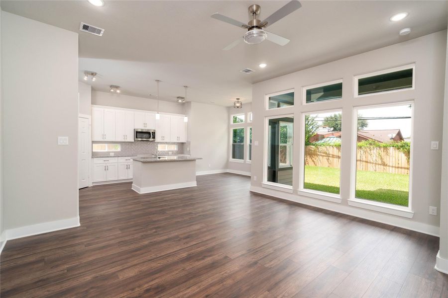 Spacious and open living room with full wall of windows that offer tons of natural light Spacious and open living room with full wall of windows that offer tons of natural light