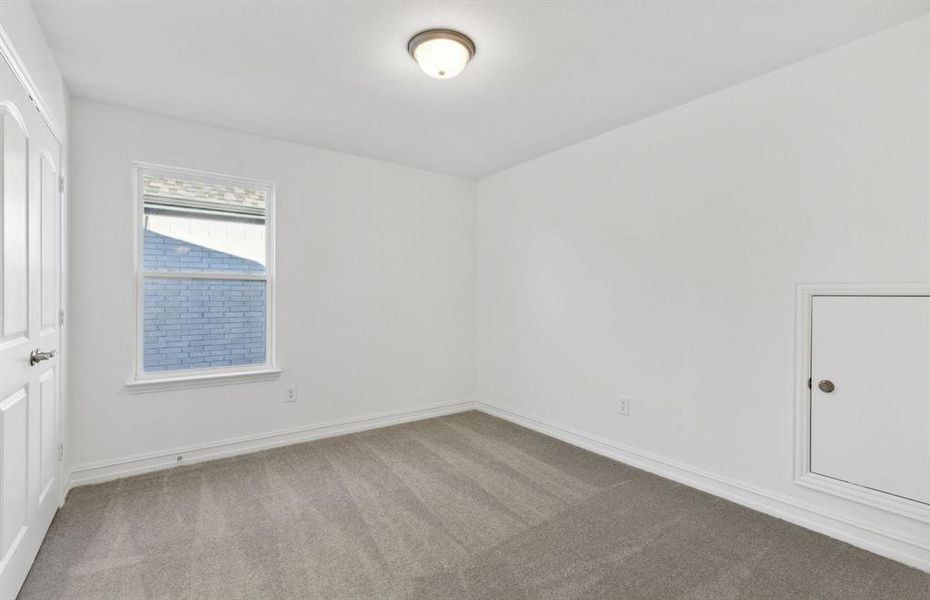 Spacious secondary bedroom with ample closet space *real home pictured