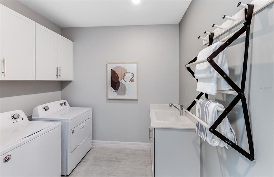 Furnished interior view inside a new home in The Strand at Cedar Grove, North Port (Image 3). Furnished interior view inside a new home in The Strand at Cedar Grove, North Port (Image 3).