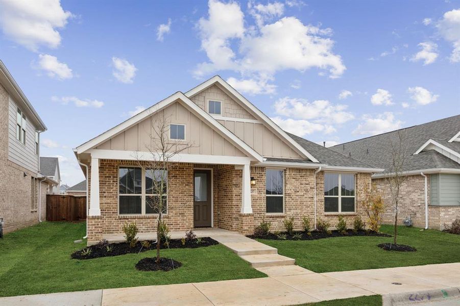 Craftsman-style home featuring a front lawn