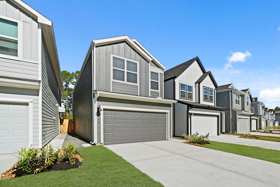 Front exterior of a new home in Bridges on Lake Houston Villas, Humble, TX, highlighting curb appeal (Image 18).