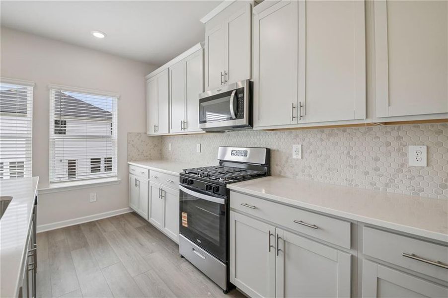 Furnished interior view inside a new home in Northwoods at Mirror Lake, Villa Rica (Image 8).