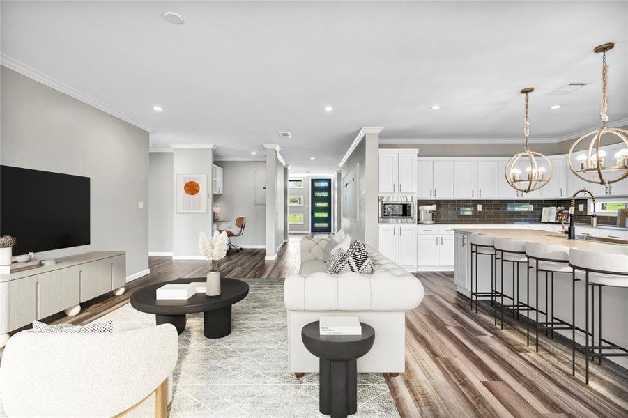Living room with crown molding, a chandelier, recessed lighting, and light wood-style flooring
