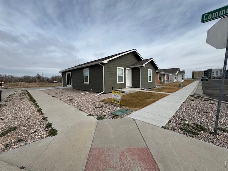 Front exterior of a new home in , Fort Morgan, CO, highlighting curb appeal (Image 13).