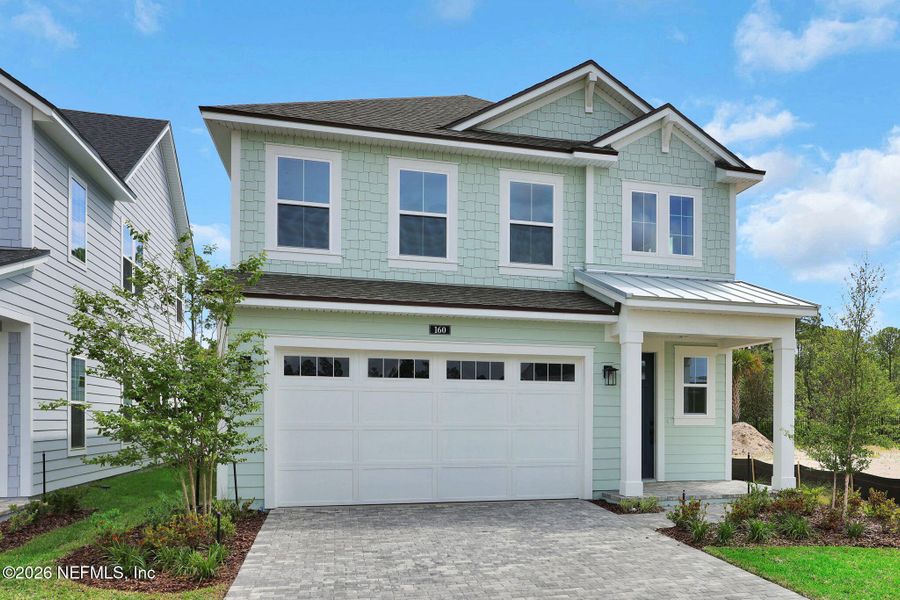 Front exterior of a new home in Seabrook Village at Seabrook, Nocatee, FL, highlighting curb appeal (Image 29).