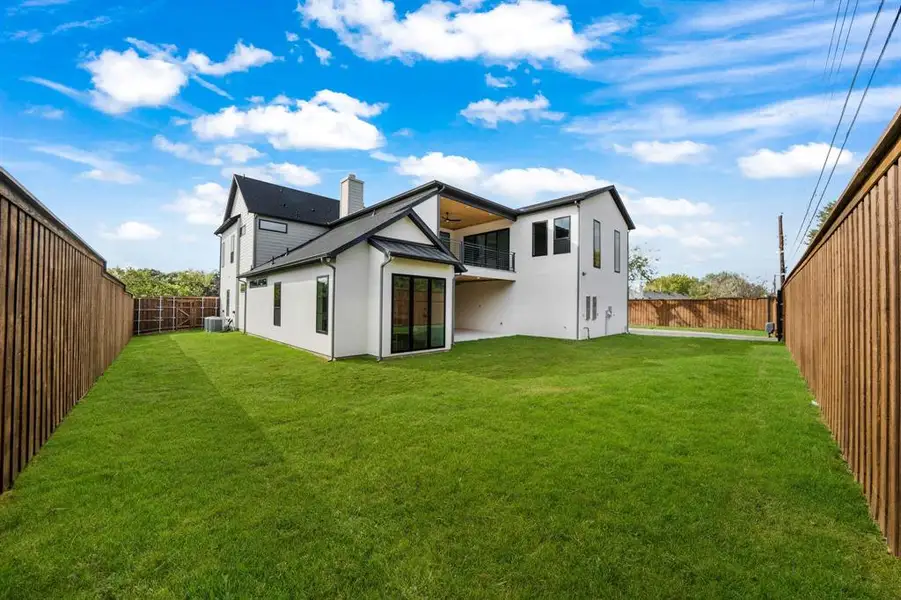 Rear view of property featuring a fenced backyard, a patio, ceiling fan, and stucco siding