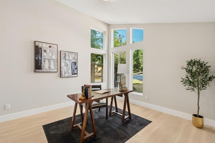 Vaulted ceilings highlight a wall of multi-pane windows Vaulted ceilings highlight a wall of multi-pane windows