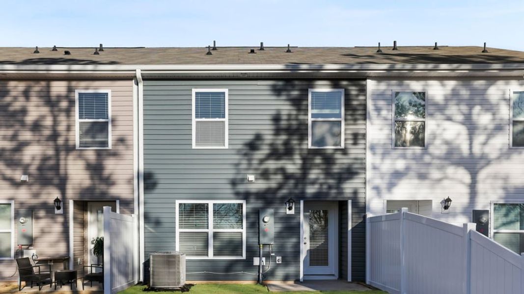 Exterior details and patio area of a home in Chestnut Ridge Townhomes, Greenville (Image 20). Exterior details and patio area of a home in Chestnut Ridge Townhomes, Greenville (Image 20).