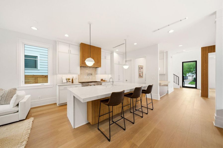 Open concept kitchen offers custom cabinetry, Thermador appliances, island seating. Functional for everyday living. Open concept kitchen offers custom cabinetry, Thermador appliances, island seating. Functional for everyday living.