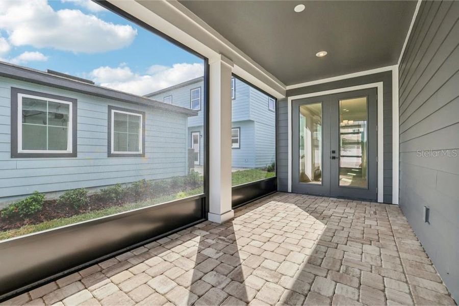 Exterior details and patio area of a home in Northlake Classical, Winter Garden (Image 18).