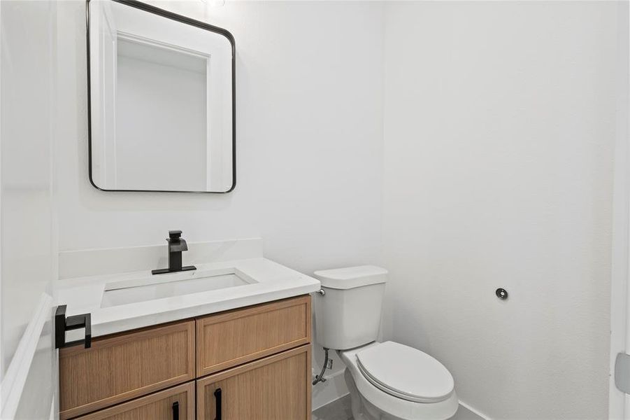 Bathroom with toilet and vanity