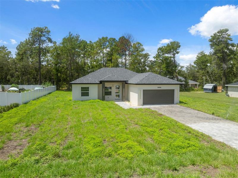 Front exterior of a new home in , Ocala, FL, highlighting curb appeal (Image 17).