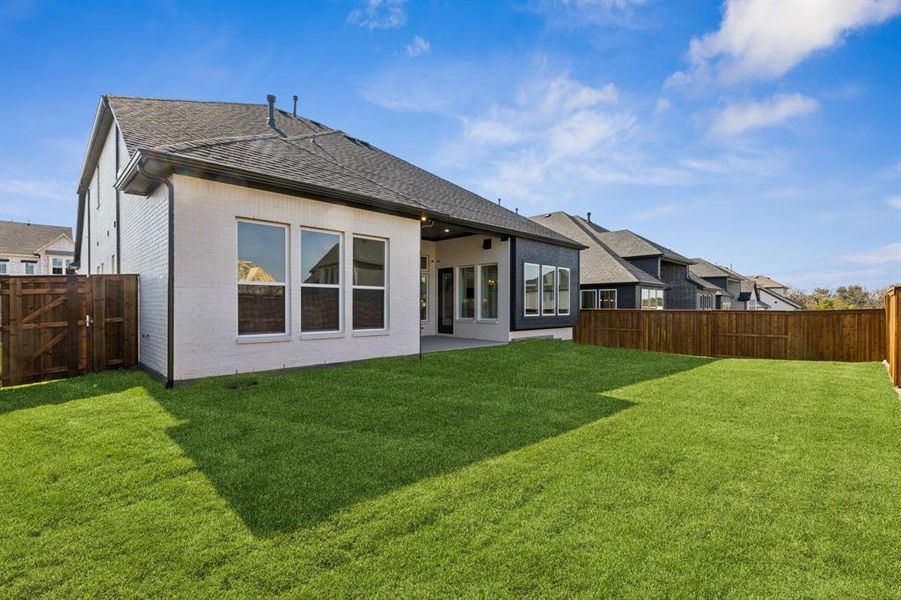 Featuring a wonderful covered back patio and private fenced yard, this dream home offers the perfect outdoor entertainment area.