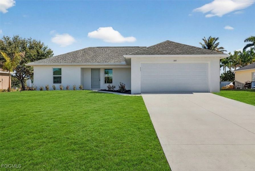 Front exterior of a new home in Cape Coral, Cape Coral, FL, highlighting curb appeal (Image 2). Front exterior of a new home in Cape Coral, Cape Coral, FL, highlighting curb appeal (Image 2).